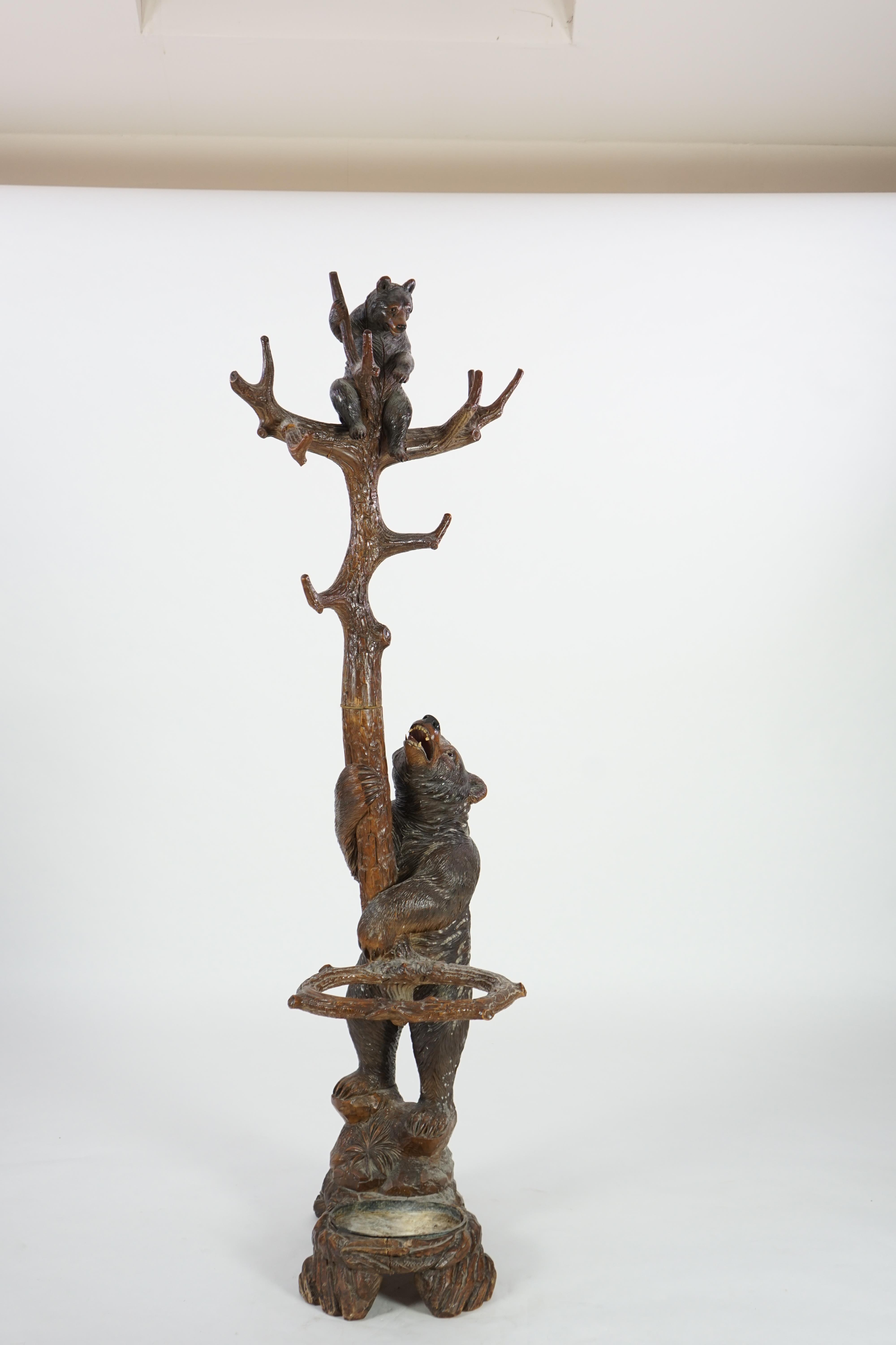 A 19th century Black Forest carved wood bear and cub hall stand